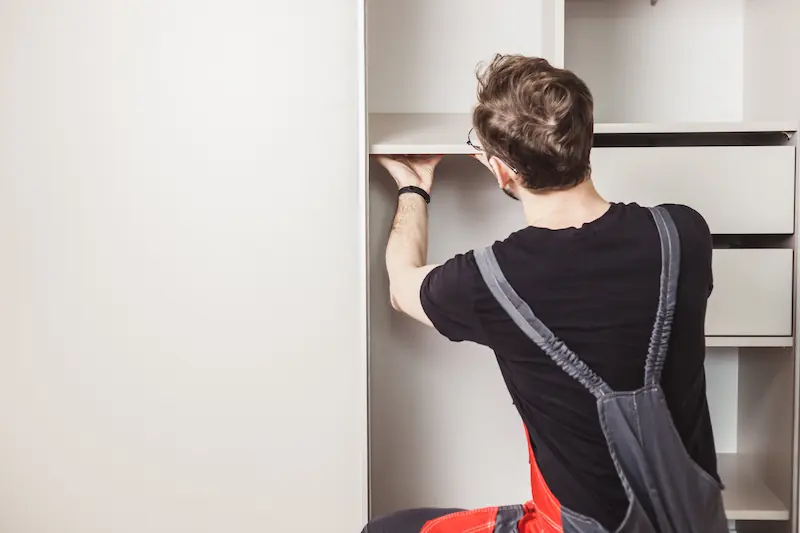 PK Floor team working for installing shoe cabinet for home