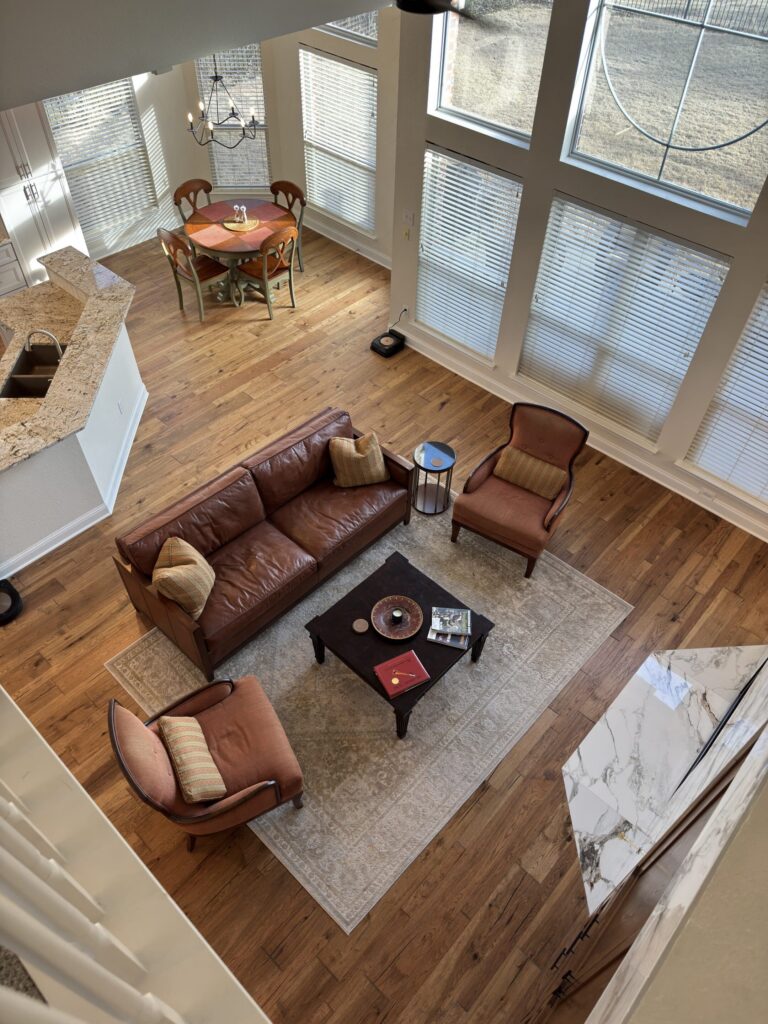 Open living room with hardwood floors in Rockwall Texas home remodel